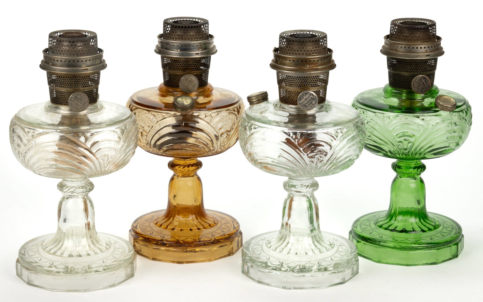 ALADDIN MODEL B-47, B-48, AND B-49 / WASHINGTON DRAPE KEROSENE STAND LAMPS, LOT OF FOUR: ALADDIN MODEL B-47, B-48, AND B-49 / WASHINGTON DRAPE KEROSENE STAND LAMPS, LOT OF FOUR, comprising of two Clear Beta Crystal; one Green Beta Crystal; and a light Amber Beta C
