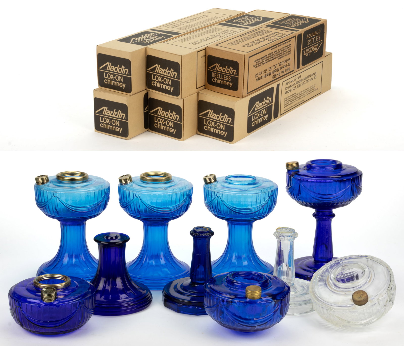 ALADDIN REISSUE LINCOLN DRAPE KEROSENE STAND LAMPS AND CHIMNEYS, LOT OF 13: ALADDIN REISSUE LINCOLN DRAPE KEROSENE STAND LAMPS AND CHIMNEYS, LOT OF 13, comprising of three Sapphire blue and a Cobalt blue Short Lincoln Drapes, each having a circular-form foot, each emboss