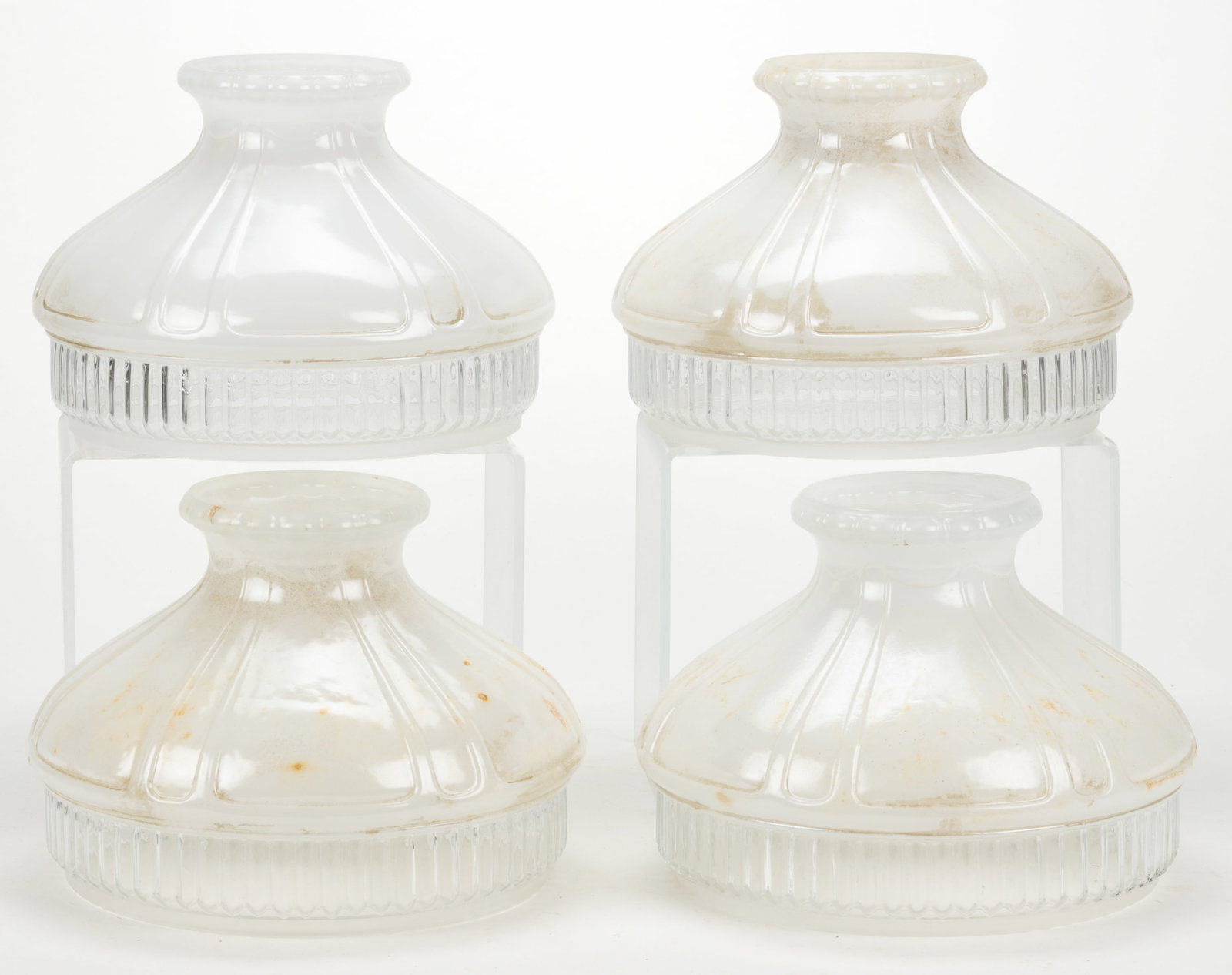 ALADDIN MODEL 601 KEROSENE LAMP SHADES, LOT OF FOUR: ALADDIN MODEL 601 KEROSENE LAMP SHADES, LOT OF FOUR, colorless with a white fired-on enameled top, colorless ribbed apron. The Mantle Lamp Company of America (Aladdin). First half 20th century. 8