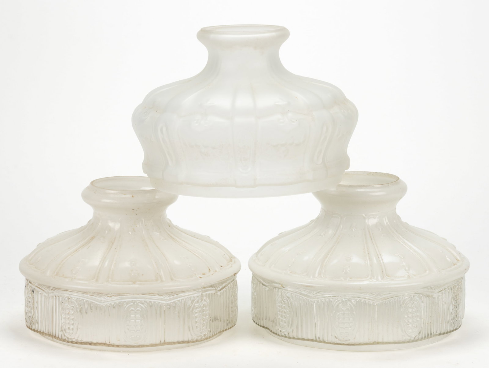 ASSORTED ALADDIN KEROSENE LAMP SHADES, LOT OF THREE: ASSORTED ALADDIN KEROSENE LAMP SHADES, LOT OF THREE, comprising of two Model 501 examples, each having a white fired-on enameled top and a colorless ribbed apron, 9 3/4" and 9 7/8"
