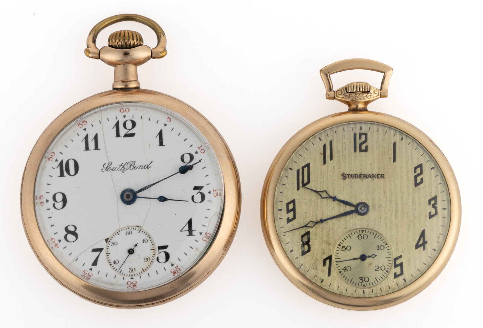SOUTH BEND 21- AND 17-JEWEL POCKET WATCHES, LOT OF TWO: SOUTH BEND 21- AND 17-JEWEL POCKET WATCHES, LOT OF TWO, Grade 211, model 2 (serial no. 703930), 17-jewels, pendant-set movement with white enamel dial, Arabic numeral chapter ring, blued-steel spade h
