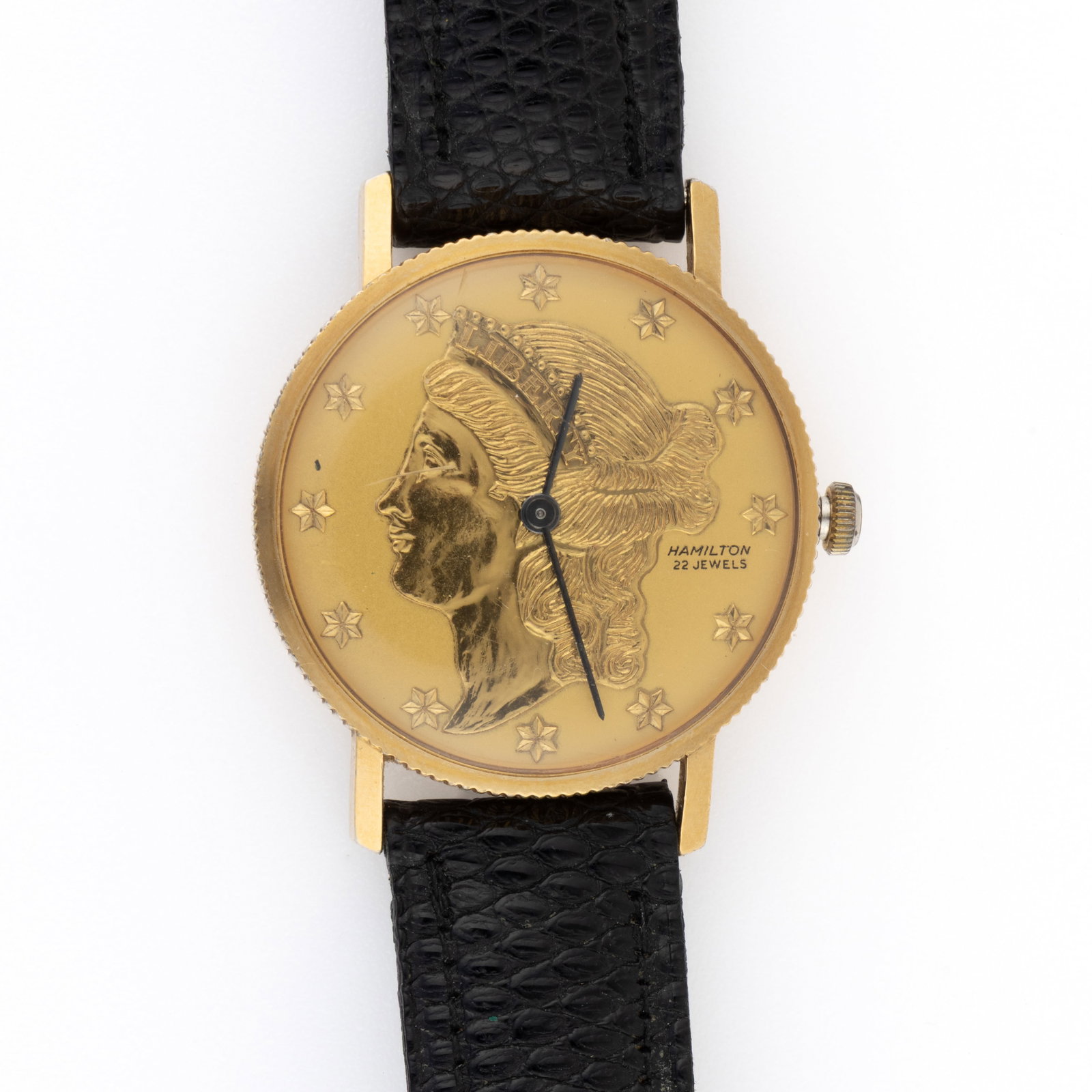 VINTAGE HAMILTON 10K RGP LIBERTY COIN MEN'S WRIST WATCH: VINTAGE HAMILTON 10K RGP LIBERTY COIN MEN'S WRIST WATCH, 22-jewels, 770 movement, having a gold dial with the image of the Liberty Coin, black baton hands, housed in a 10K yellow rolled gold plate