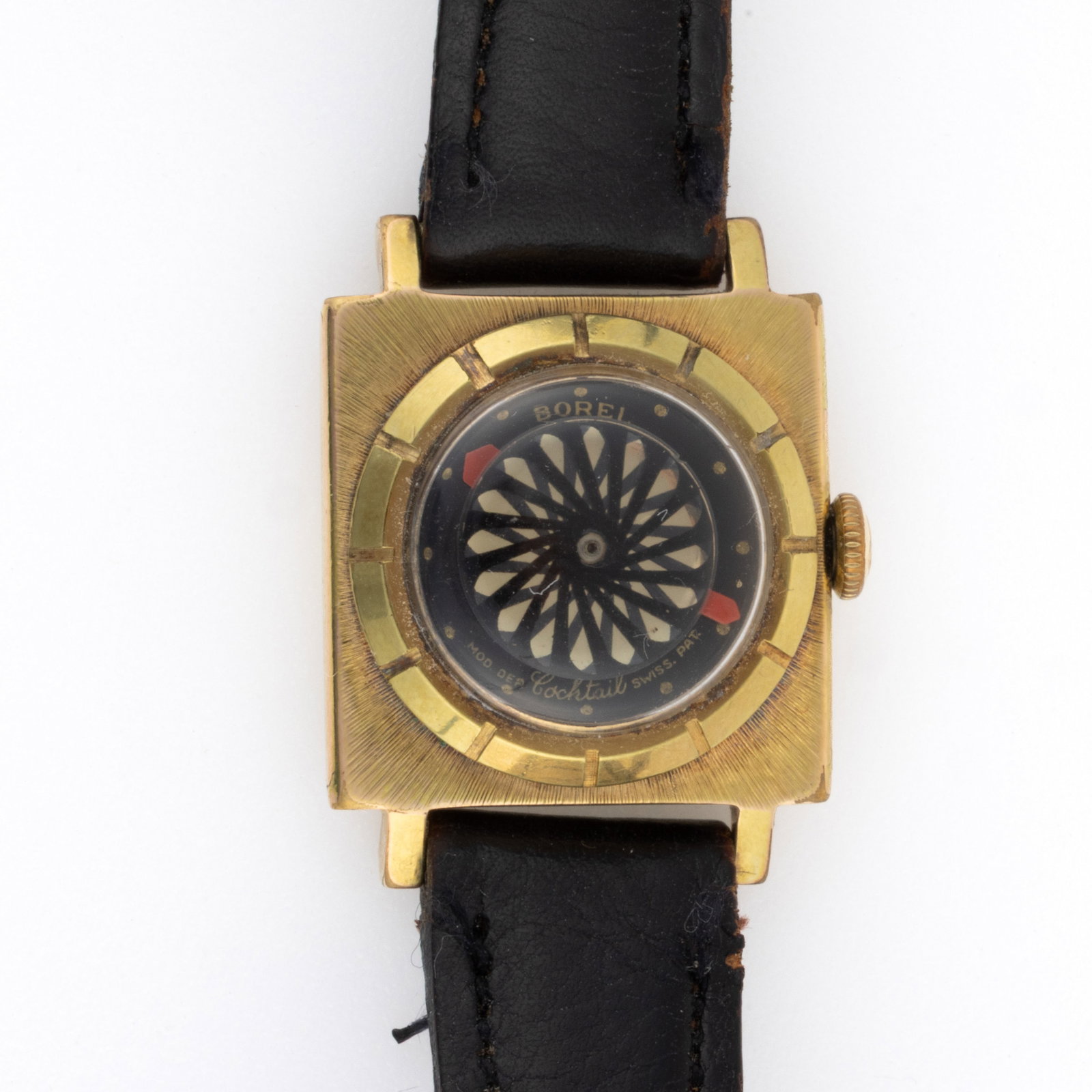 VINTAGE ERNEST BOREL KALEIDOSCOPE COCKTAIL LADY'S WRIST WATCH: VINTAGE ERNEST BOREL KALEIDOSCOPE COCKTAIL LADY'S WRIST WATCH, 17-jewels, black kaleidoscope dial with round gold indices and red hands, housed in a yellow gold-plated square case with black leath