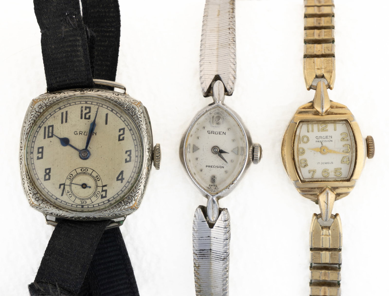 VINTAGE GRUEN LADY'S WRIST WATCHES, LOT OF THREE: VINTAGE GRUEN LADY'S WRIST WATCHES, LOT OF THREE, comprising two Precisions, one marquise shape with 10K rolled gold bezel and bracelet and stainless steel back, unable to remove back to see 