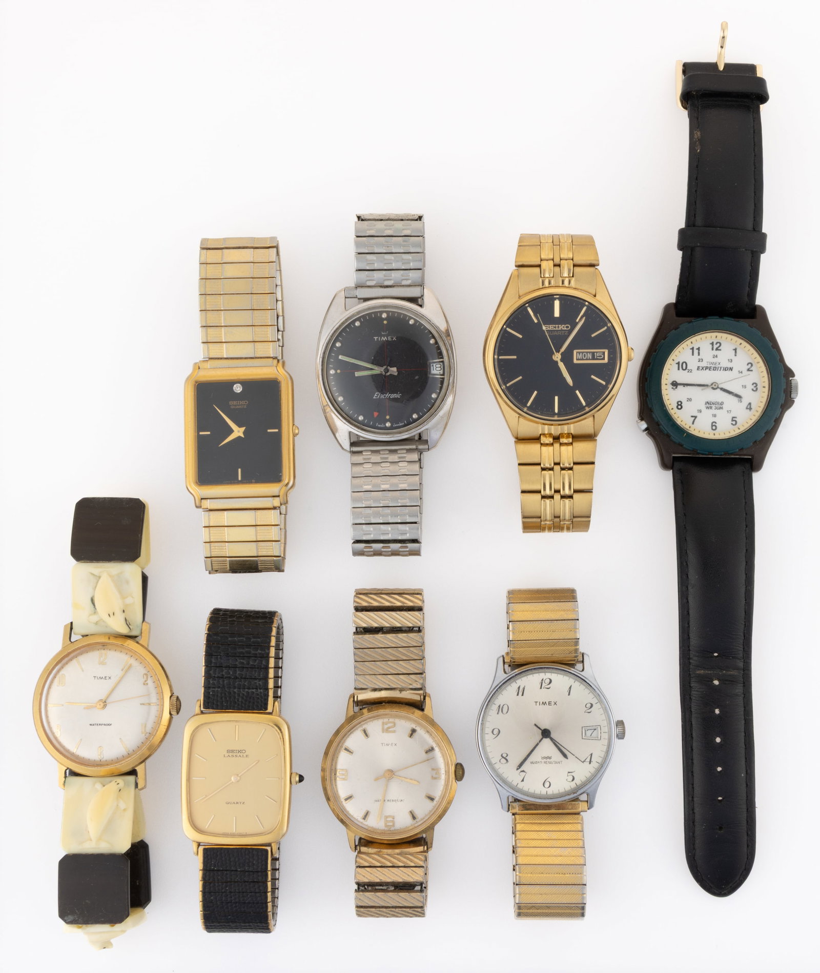 VINTAGE AND CONTEMPORARY TIMEX AND SEIKO MEN'S WRIST WATCHES, LOT OF EIGHT: VINTAGE AND CONTEMPORARY TIMEX AND SEIKO MEN'S WRIST WATCHES, LOT OF EIGHT, including Timex Marlin, Expedition, Electronic, and Seiko SX, Lassale, and 7N43-7A59. Back of 7N43-7A59 is etched "
