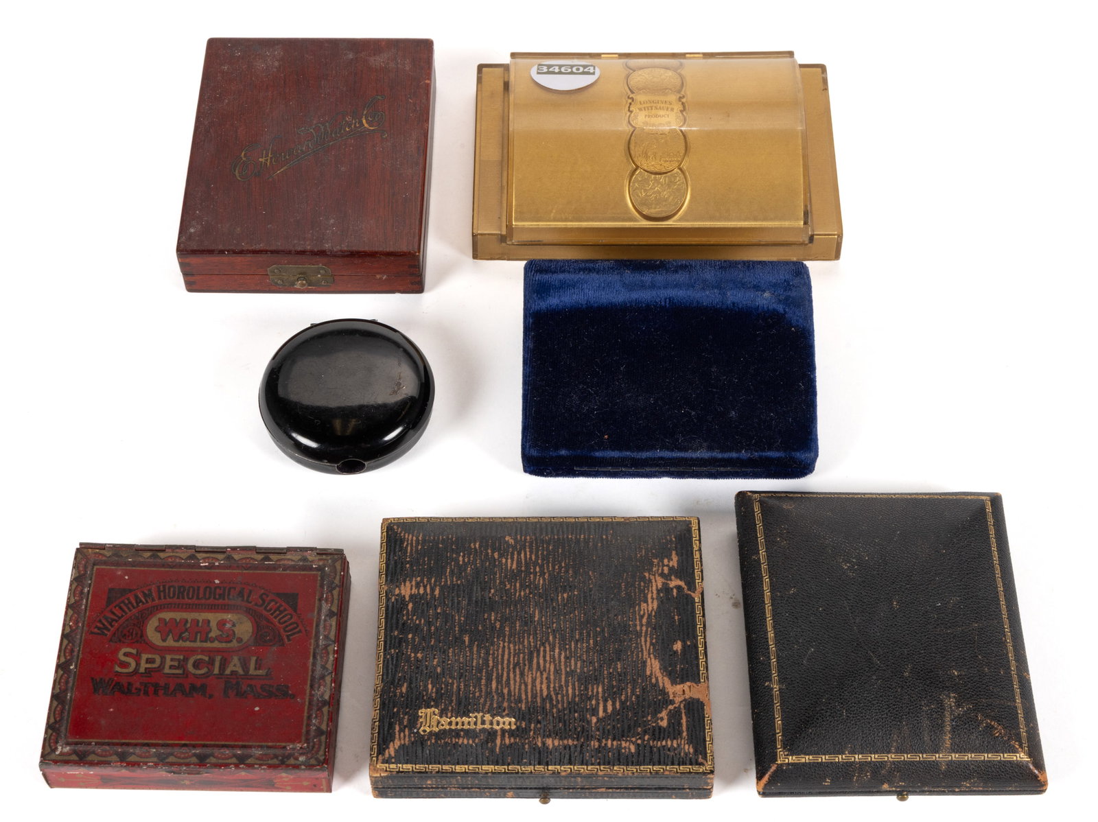 VINTAGE HAMILTON AND OTHER EMPTY WATCH RELATED BOXES, LOT OF SEVEN: VINTAGE HAMILTON AND OTHER EMPTY WATCH RELATED BOXES, LOT OF SEVEN, comprising a black leather Hamilton box with black velvet lining and Hamilton ribbon and note, a wooden Howard box with yellow 