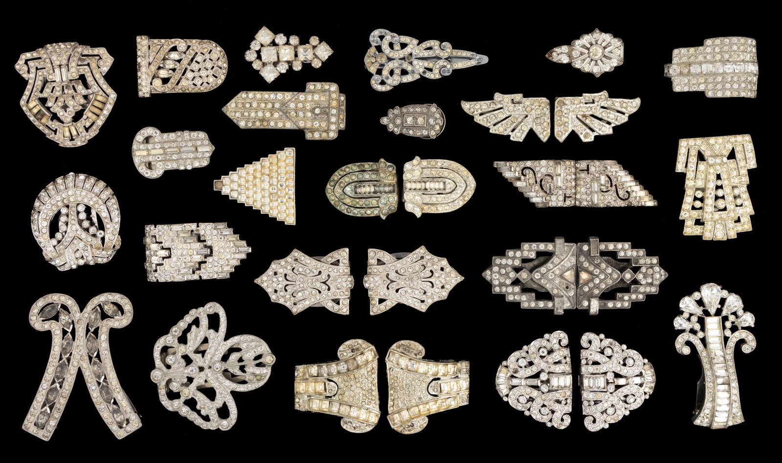 VINTAGE ART DECO RHINESTONE DRESS CLIPS, LOT OF 30: VINTAGE ART DECO RHINESTONE DRESS CLIPS, LOT OF 30, each piece made with silver-toned metal featuring colorless rhinestones and a hinged clip to back, including seven pairs, and a single clip marked f