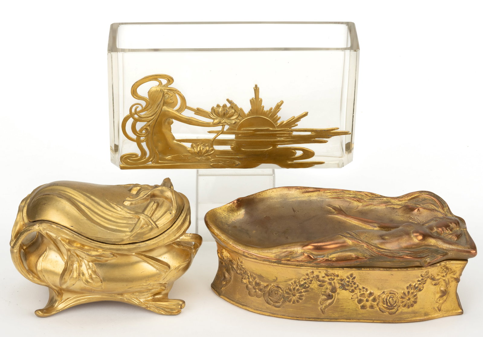 ASSORTED ART NOUVEAU DRESSER BOXES AND RELATED ARTICLES, LOT OF THREE: ASSORTED ART NOUVEAU DRESSER BOXES AND RELATED ARTICLES, LOT OF THREE, comprising a box marked for "BENEDICT" with an outstretched nude woman on the lid; a smaller example marked "ROGER