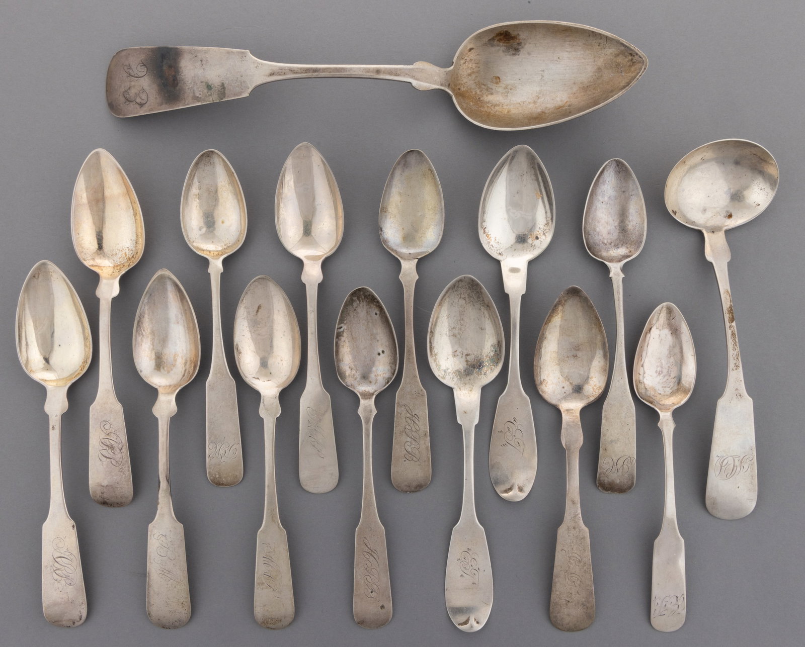CONNECTICUT AND MASSACHUSETTS COIN SILVER SPOONS AND CREAM LADLE, LOT OF 15: CONNECTICUT AND MASSACHUSETTS COIN SILVER SPOONS AND CREAM LADLE, LOT OF 15, each having a fiddle handle with pointed shoulders and a personalized engraving; comprising a pair of teaspoons by / retail