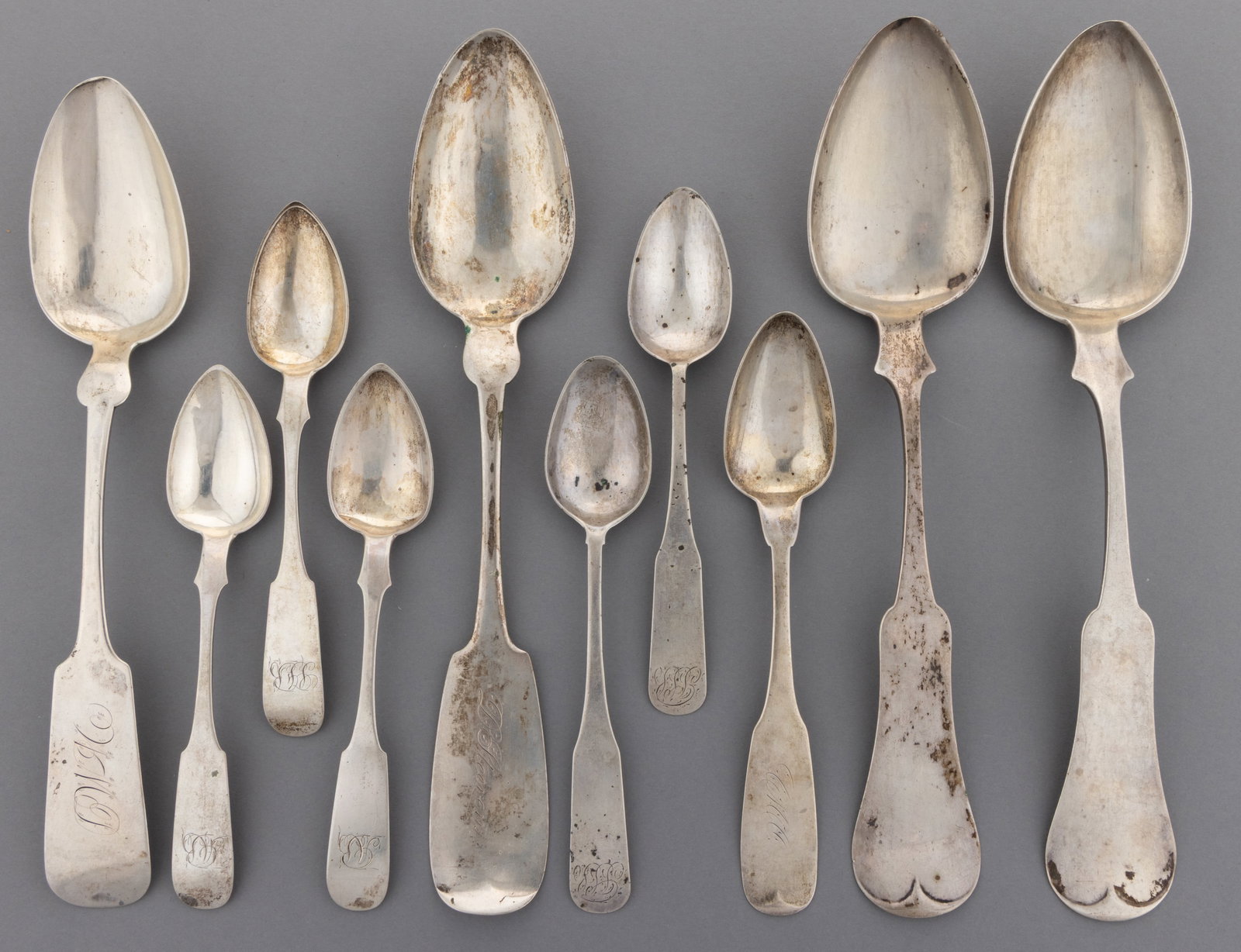 MARYLAND AND OTHER COIN SILVER SPOONS, LOT OF TEN: MARYLAND AND OTHER COIN SILVER SPOONS, LOT OF TEN, each having a pointed oval bowl on a fiddle handle, most having personalized engravings; comprising a group of three 0.896 silver teaspoons by Canfie