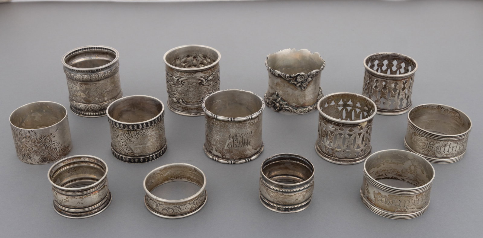 GORHAM AND OTHER STERLING SILVER AND SILVER-PLATED NAPKIN RINGS, LOT OF 13 (1 of 1)