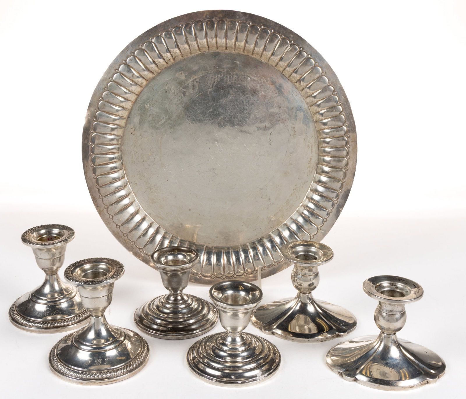 AMERICAN WEIGHTED STERLING CANDLESTICKS AND MEXICAN SILVER-PLATED TRAY, LOT OF SEVEN PIECES: AMERICAN WEIGHTED STERLING CANDLESTICKS AND MEXICAN SILVER-PLATED TRAY, LOT OF SEVEN PIECES, comprising three pairs of short weighted sterling silver candlesticks, consisting of one pair without maker