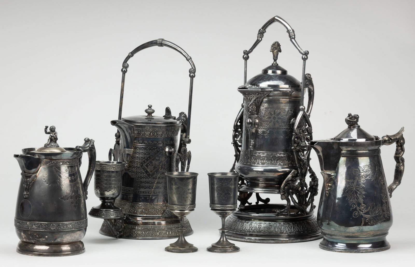 MERIDEN BRITANNIA AND OTHER SILVER-PLATED ICED WATER PITCHERS AND GOBLES, LOT OF SEVEN: MERIDEN BRITANNIA AND OTHER SILVER-PLATED ICED WATER PITCHERS AND GOBLES, LOT OF SEVEN, including a three-piece set by The Meriden Britannia Co. of Meriden, CT (active 1852-1898/1930s) with each