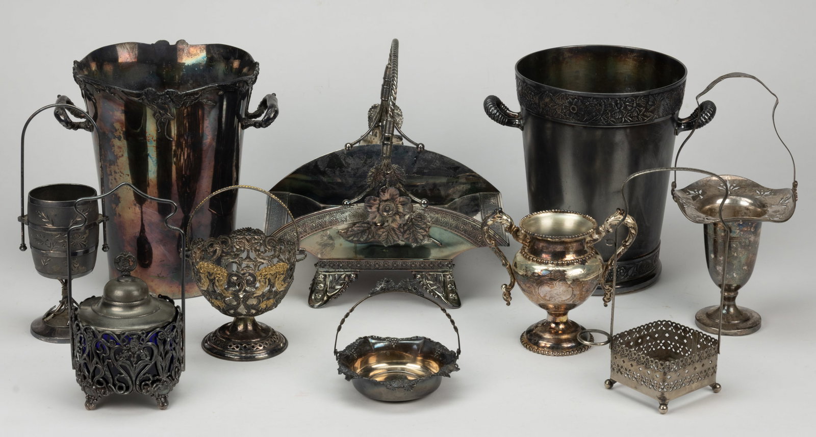 MERIDEN BRITANNIA AND OTHER SILVER-PLATED ARTICLES, LOT OF TEN: MERIDEN BRITANNIA AND OTHER SILVER-PLATED ARTICLES, LOT OF TEN, including a no. 1391 barrel-form article by The Meriden Britannia Co. of Meriden, CT (active 1852-1898) having a bail handle and raised