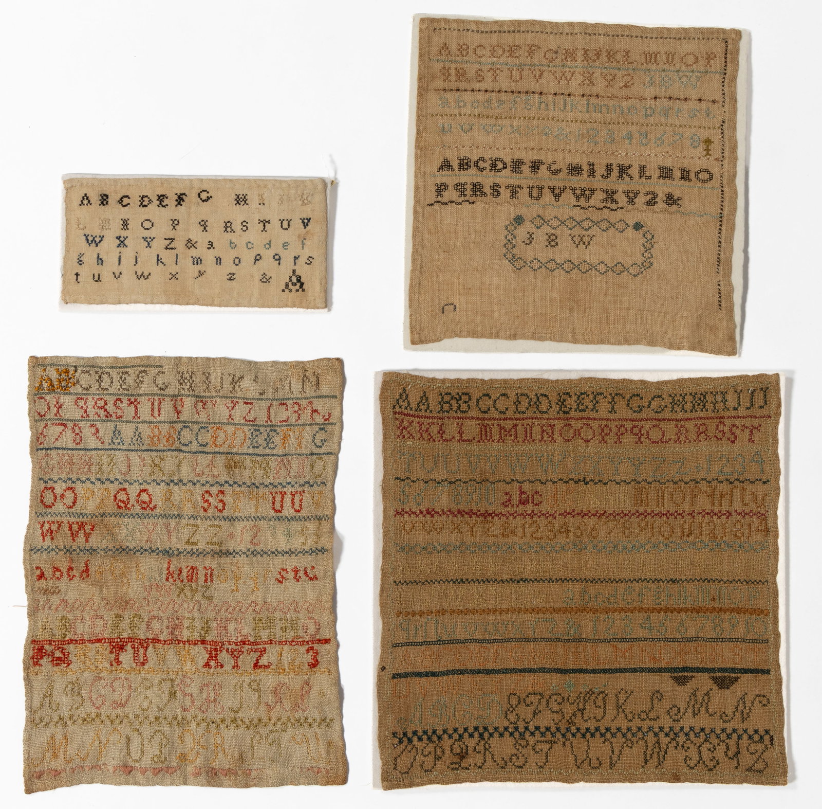 AMERICAN NEEDLEWORK SAMPLERS, LOT OF FOUR: AMERICAN NEEDLEWORK SAMPLERS, LOT OF FOUR, silk and/or wool on linen; comprising a square example possibly made by J.B. Miller (unknown maiden name, b.1820) of Warren, NC, having six alphabet and nume