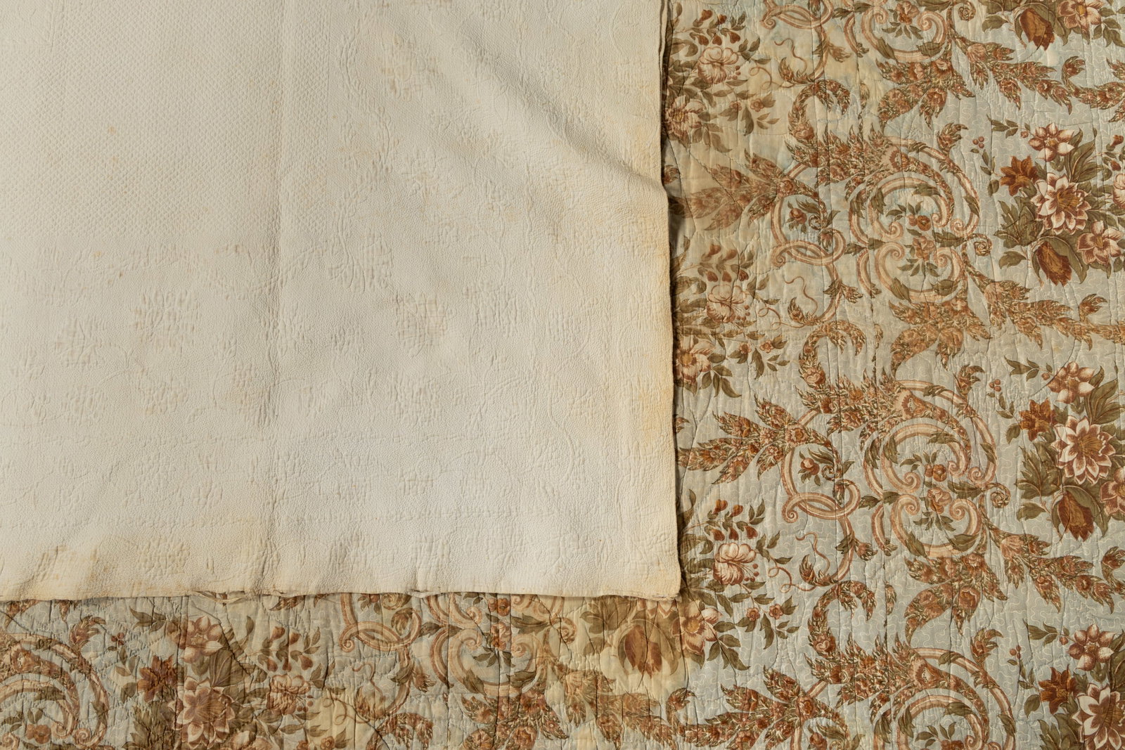 AMERICAN WHITEWORK QUILT AND CHINTZ WHOLE-CLOTH QUILTED BED COVER, LOT OF TWO:  AMERICAN WHITEWORK QUILT AND CHINTZ WHOLE-CLOTH QUILTED BED COVER, LOT OF TWO, hand-stitched; comprising a whitework quilt, attributed to an unknown maker in Georgetown / Washington, DC, each si