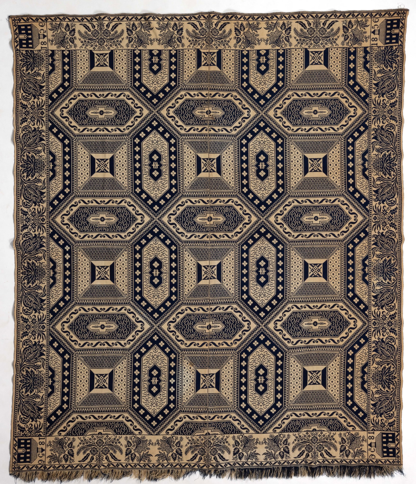 INDIANA DATED DOUBLE WEAVE COVERLET: INDIANA DATED DOUBLE WEAVE COVERLET, dark blue wool and natural cotton, two joined panels, center featuring a geometric pattern, all four sides with floral and foliate border, bottom edge with