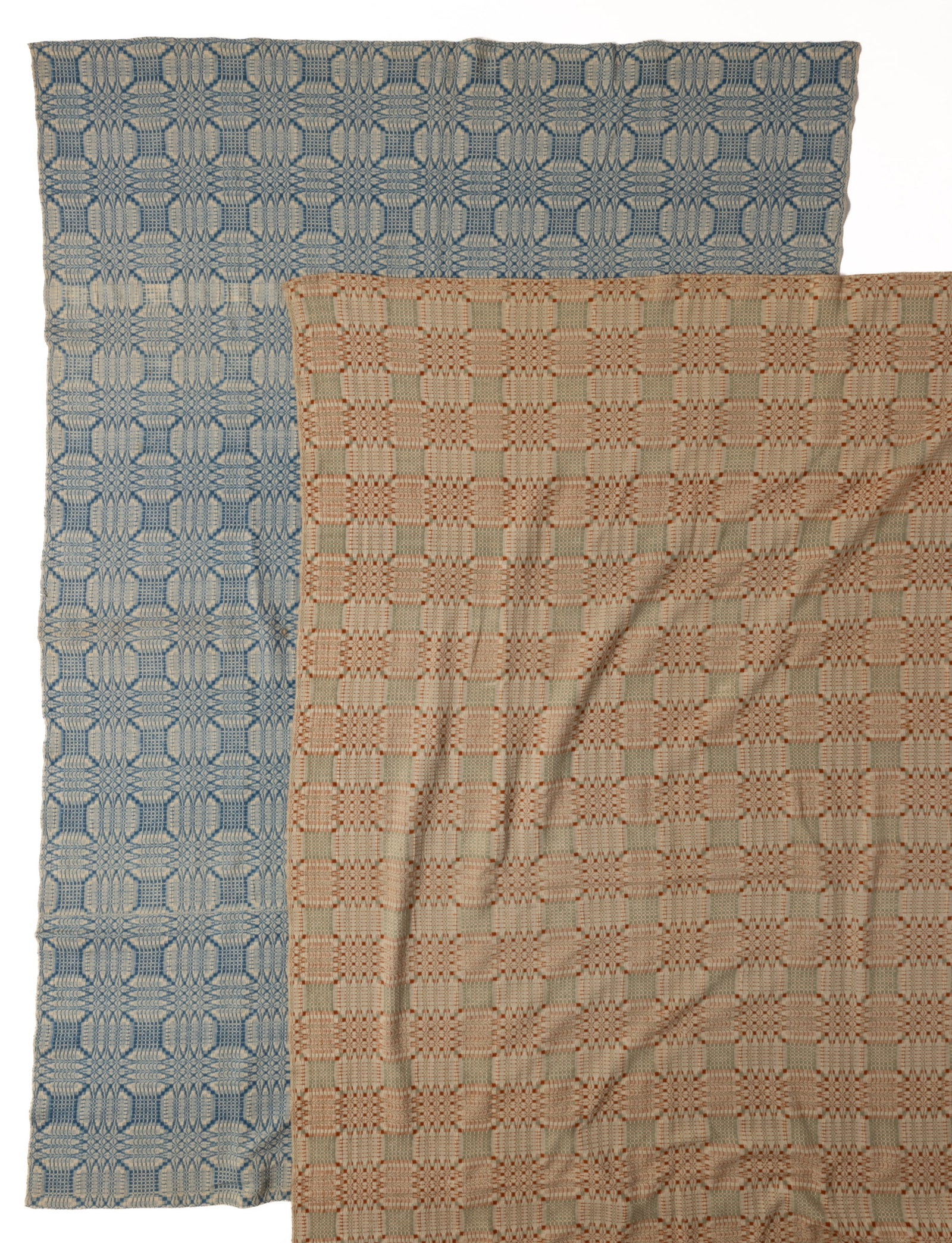 ANTIQUE / VINTAGE AMERICAN "PINE CONE BLOOM" OVERSHOT COVERLETS, LOT OF TWO: ANTIQUE / VINTAGE AMERICAN "PINE CONE BLOOM" OVERSHOT COVERLETS, LOT OF TWO, each with mint green and orangish-brown or medium blue wool and natural cotton, whole panel, having all-over geom