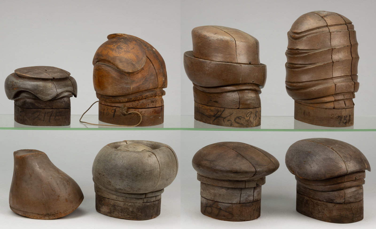 MILLINER'S HAT MOLDS / FORMS, LOT OF EIGHT: MILLINER'S HAT MOLDS / FORMS, LOT OF EIGHT, each of turned and carved form and most able to break down into many pieces to release the hat once it has been molded. 20th century. Tallest 11 3/4&quo