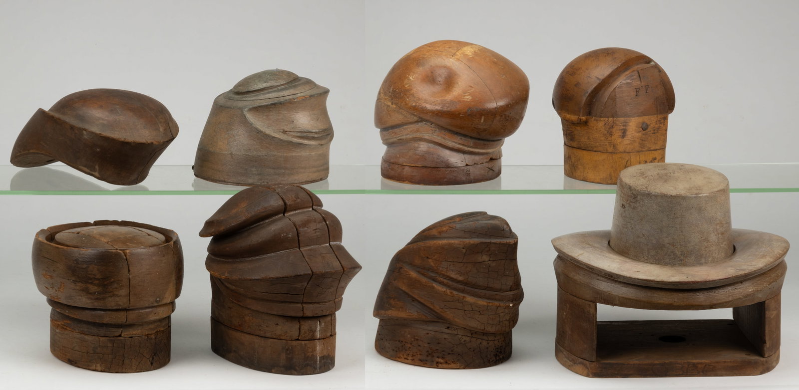 MILLINER'S HAT MOLDS / FORMS, LOT OF EIGHT: MILLINER'S HAT MOLDS / FORMS, LOT OF EIGHT, each of turned and carved form, three examples able to break down into many pieces to release the hat once it has been molded. 20th century. Tallest 9 1