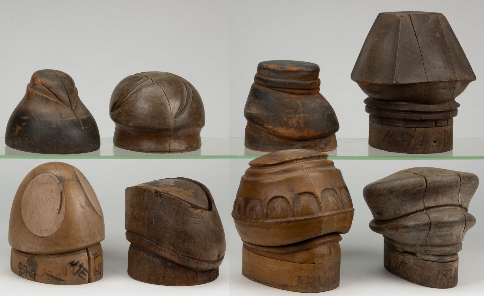 MILLINER'S HAT MOLDS/ FORMS, LOT OF EIGHT: MILLINER'S HAT MOLDS / FORMS, LOT OF EIGHT, each of turned and carved form, four examples able to break down into many pieces to release the hat once it has been molded. 20th century. Tallest