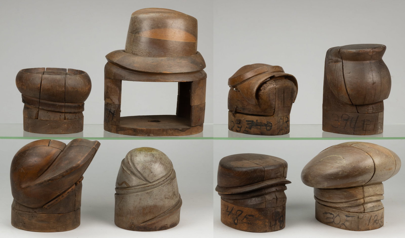 MILLINER'S HAT MOLDS / FORMS, LOT OF EIGHT: MILLINER'S HAT MOLDS / FORMS, LOT OF EIGHT, each of turned and carved form and most able to break down into many pieces to release the hat once it has been molded. 20th century. Tallest 13" H