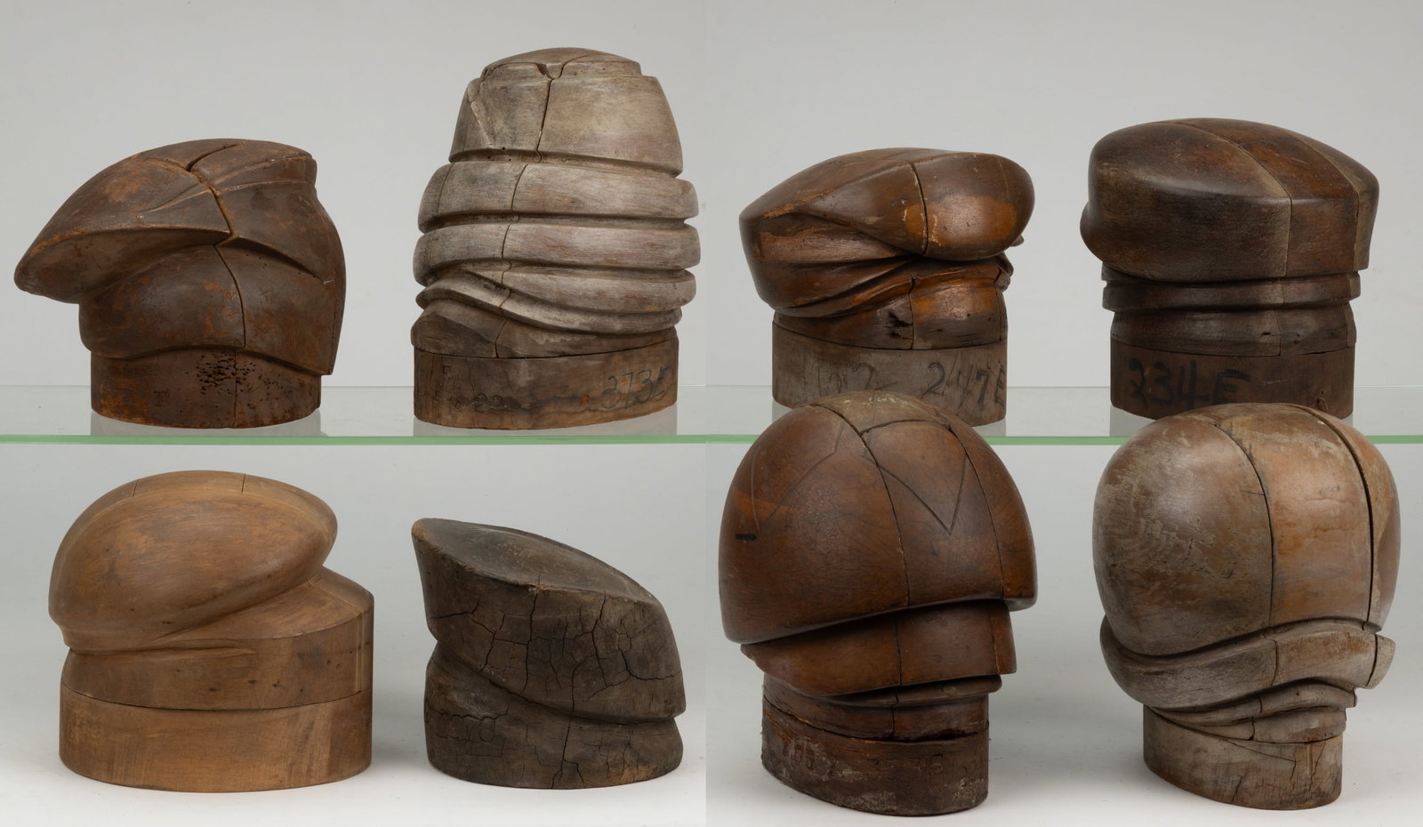 MILLINER'S HAT MOLDS / FORMS, LOT OF EIGHT: MILLINER'S HAT MOLDS / FORMS, LOT OF EIGHT, each of turned and carved form and most able to break down into many pieces to release the hat once it has been molded. 20th century. Tallest 10 1/4&quo