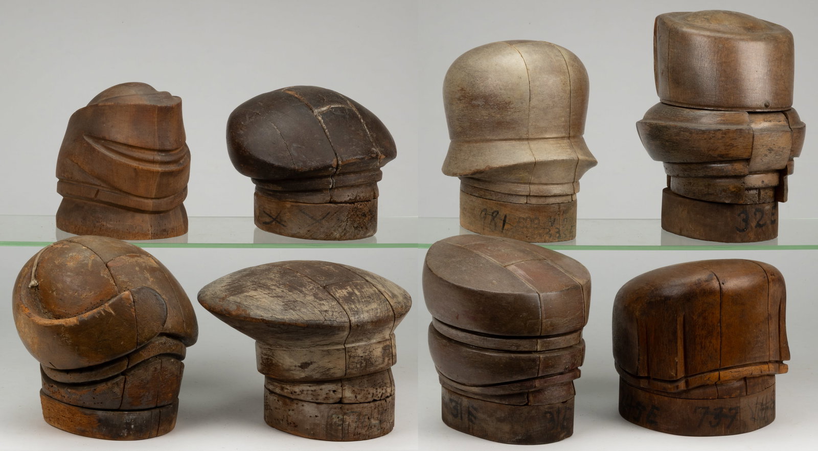 MILLINER'S HAT MOLDS / FORMS, LOT OF EIGHT: MILLINER'S HAT MOLDS / FORMS, LOT OF EIGHT, each of turned and carved form and most able to break down into many pieces to release the hat once it has been molded. 20th century. Tallest 11 1/2&quo