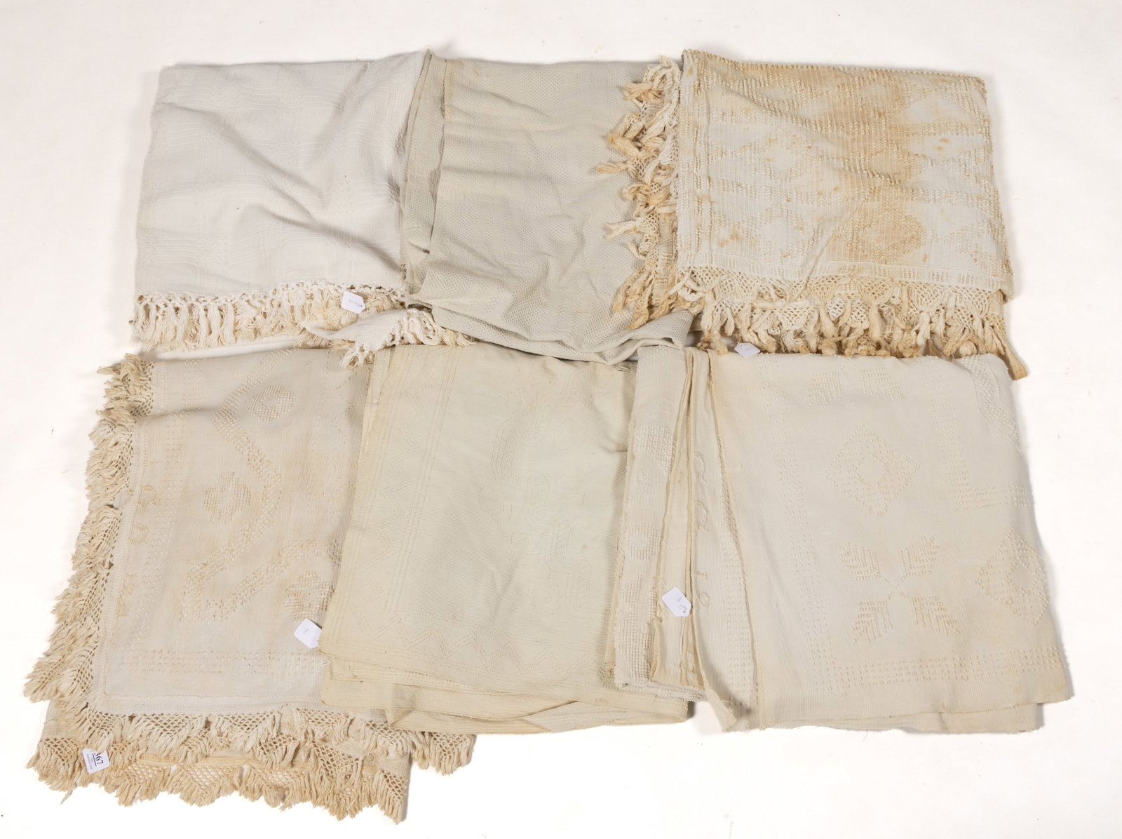 ENGLISH / AMERICAN BOLTON-TYPE COUNTERPANES AND OTHER WHITE BEDDING, LOT OF SIX: ENGLISH / AMERICAN BOLTON-TYPE COUNTERPANES AND OTHER WHITE BEDDING, LOT OF SIX, each cotton; comprising three English Bolton-type counterpanes, including one with "[GG] 12" in a lower corne