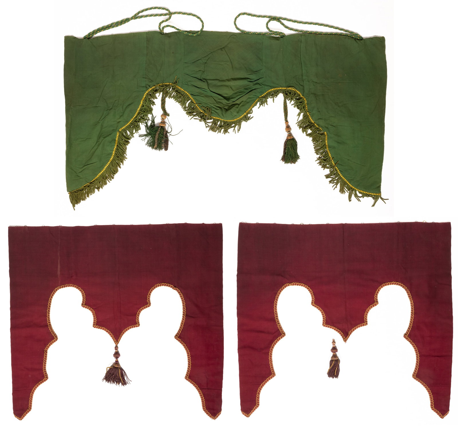 ANTIQUE WOOL CURTAINS / VALANCES, LOT OF THREE: ANTIQUE WOOL CURTAINS / VALANCES, LOT OF THREE, each piece with a ribbed wool fabric front, a tan fabric back lining, a draped / scalloped bottom edge, and one or two large tassels; comprising a large