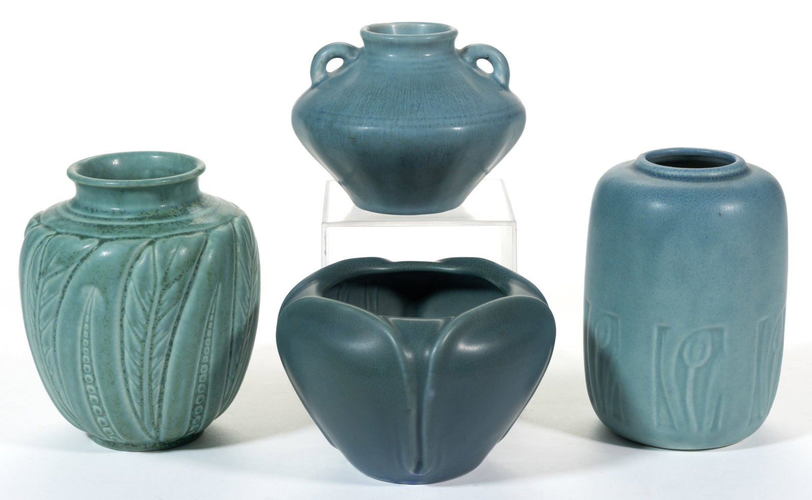 AMERICAN ROOKWOOD ART POTTERY VASES, LOT OF FOUR: AMERICAN ROOKWOOD ART POTTERY VASES, LOT OF FOUR, each having blue-teal matte glazes, comprising one "6462" example with carved foliate design, one "6103" squat-form example having
