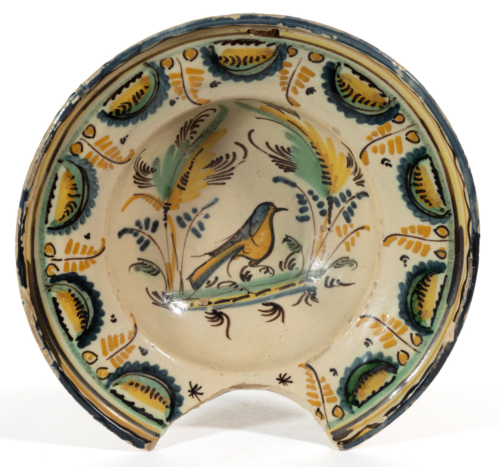 SPANISH MAIOLICA TIN-GLAZED HAND-PAINTED EARTHENWARE BARBER'S BASIN / BOWL: SPANISH MAIOLICA TIN-GLAZED HAND-PAINTED EARTHENWARE BARBER'S BASIN / BOWL, having polychrome image of a bird framed by stylized trees, with a concave area to rim and two holes to top fo