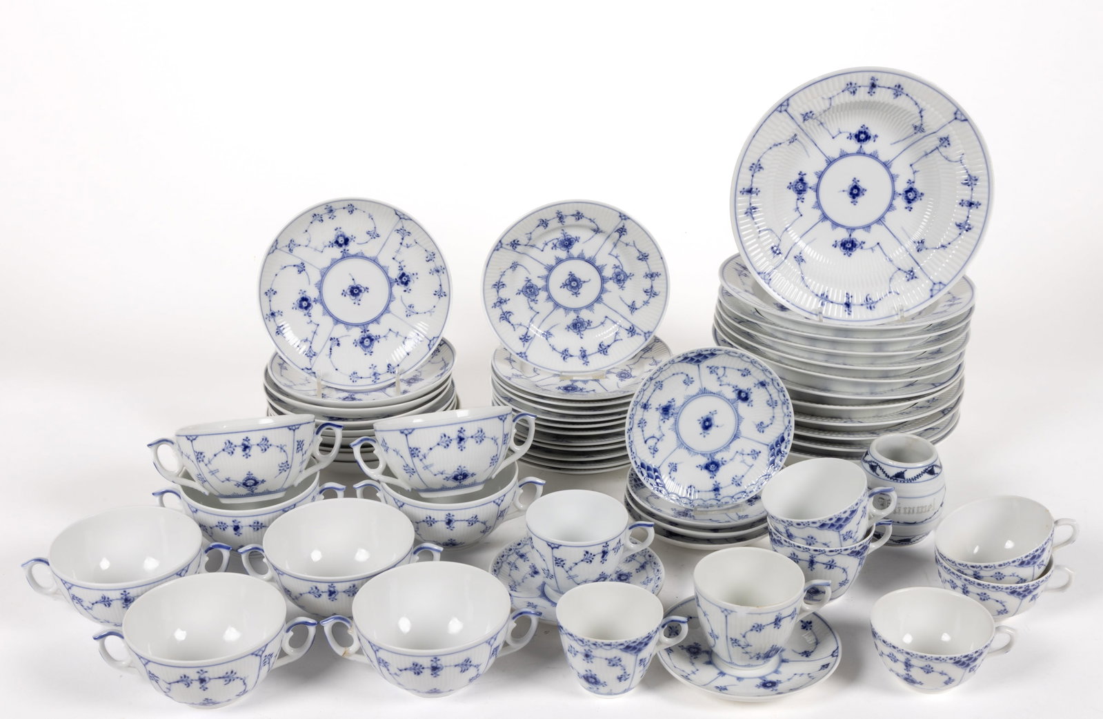 DANISH ROYAL COPENHAGEN PORCELAIN BLUE FLOWERS FLUTED TEA AND TABLE ARTICLES, LOT OF 55: DANISH ROYAL COPENHAGEN PORCELAIN BLUE FLOWERS FLUTED TEA AND TABLE ARTICLES, LOT OF 55, each of fluted form having stylized blue flowers with long stems, comprising twelve 8 3/8" D soup pla