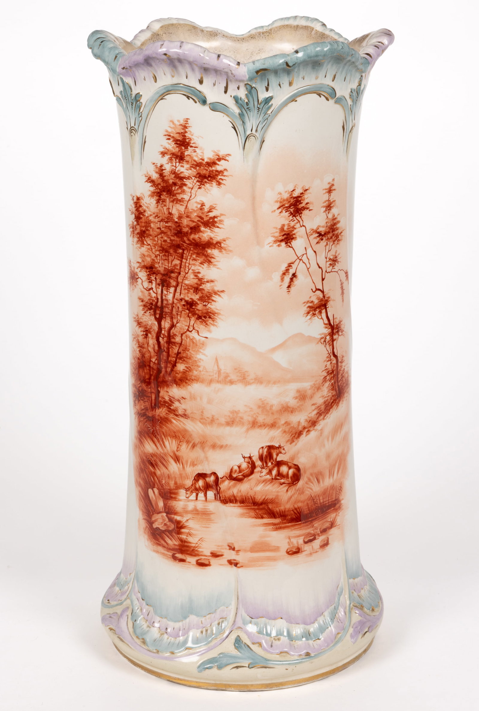 AMERICAN HAND-PAINTED CERAMIC UMBRELLA STAND: AMERICAN HAND-PAINTED CERAMIC UMBRELLA STAND, cylindrical form with a slightly flaring scalloped rim having alternating blue and lavender decorations and gilt accents, featuring red hand-pai