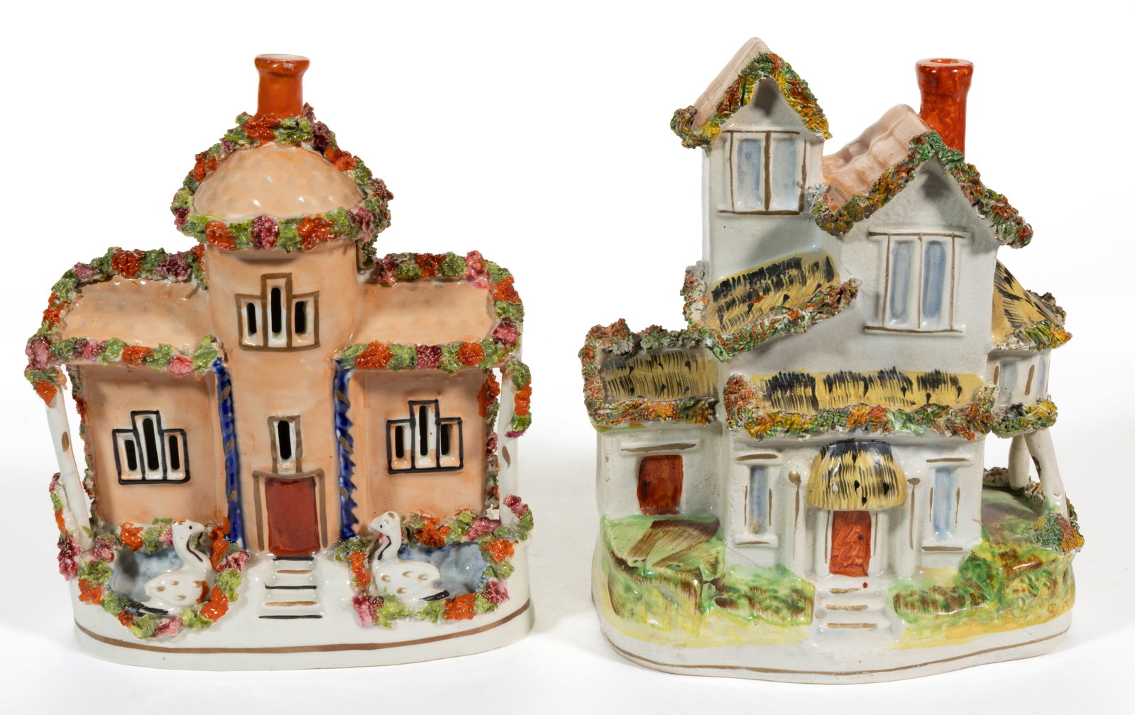 ENGLISH STAFFORDSHIRE HAND-PAINTED CERAMIC FIGURAL COTTAGES / HOUSES, LOT OF TWO: ENGLISH STAFFORDSHIRE HAND-PAINTED CERAMIC FIGURAL COTTAGES / HOUSES, LOT OF TWO, each having a single chimney, applied shredded clay accents, and polychrome enamel decorations, comprising one example