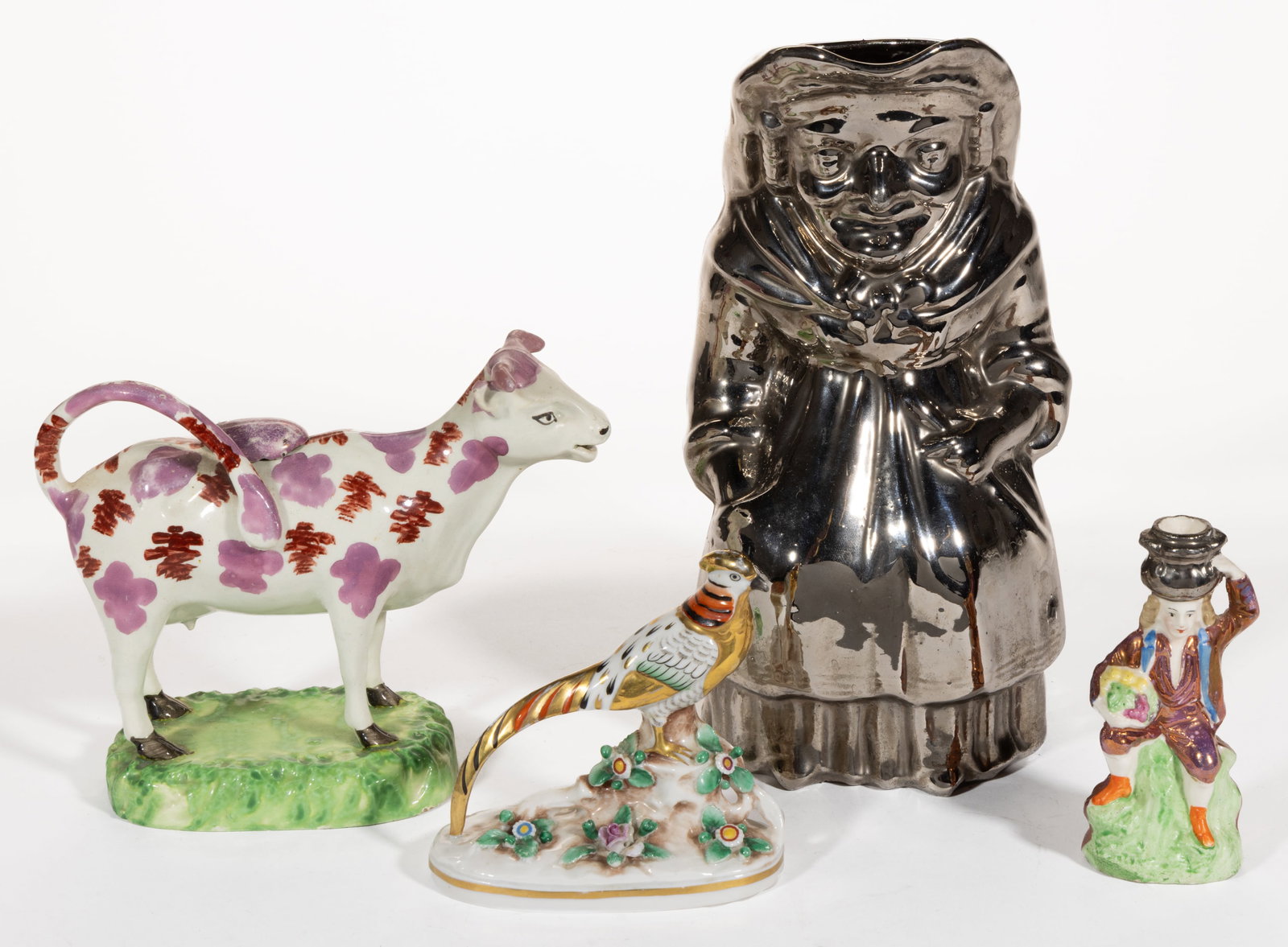 ENGLISH AND GERMAN LUSTRE-DECORATED CERAMIC FIGURAL ARTICLES, LOT OF FOUR: ENGLISH AND GERMAN LUSTRE-DECORATED CERAMIC FIGURAL ARTICLES, LOT OF FOUR, comprising two German porcelain examples including a polychrome-decorated pheasant with additional gilt decoration 