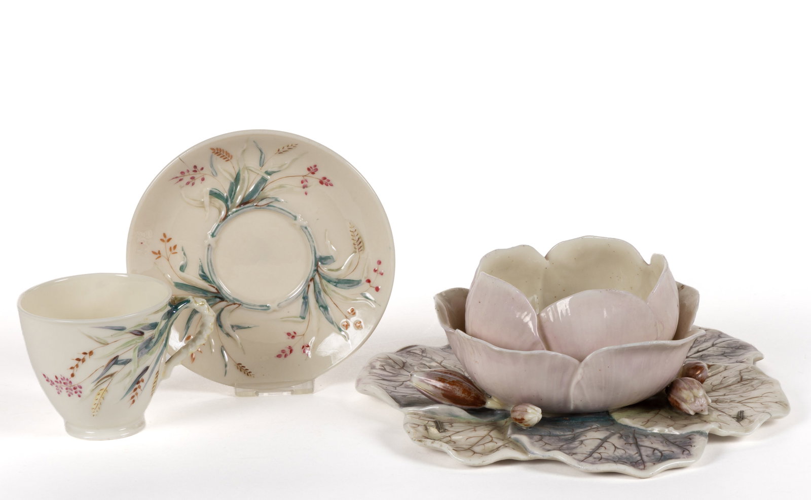 IRISH BELLEEK PORCELAIN FIRST PERIOD ARTICLES, LOT OF TWO: IRISH BELLEEK PORCELAIN FIRST PERIOD ARTICLES, LOT OF TWO, each having polychrome hand-painted decorations, comprising a water lily vase featuring a central lily with two rows of petals, and havi
