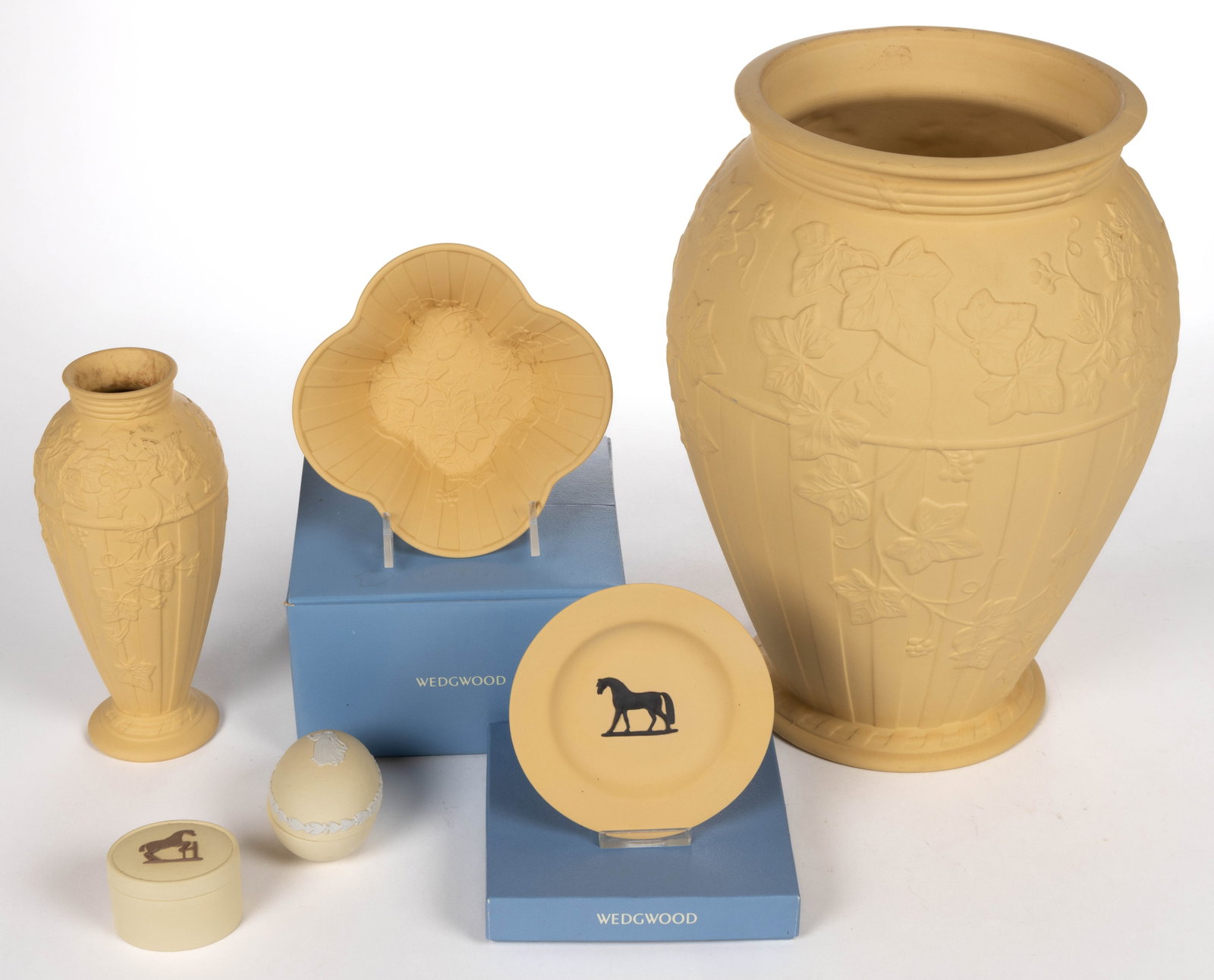 WEDGWOOD CANEWARE STONEWARE ARTICLES, LOT OF SIX: WEDGWOOD CANEWARE STONEWARE ARTICLES, LOT OF SIX, comprising an egg-shaped box having white sprig decoration depicting a classical woman in long dress with berry and leaf border, three examples with e