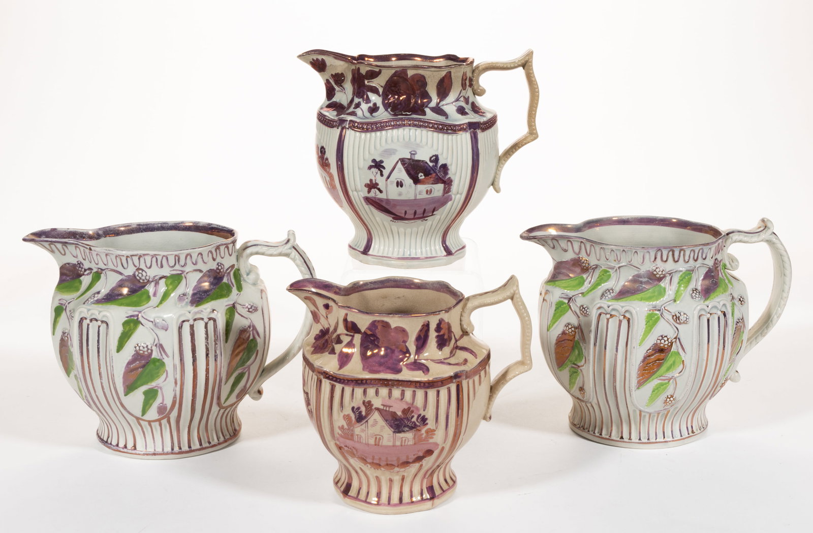 BRITISH RELIEF-MOLDED PINK LUSTRE CERAMIC JUGS / PITCHERS, LOT OF FOUR (1 of 2)