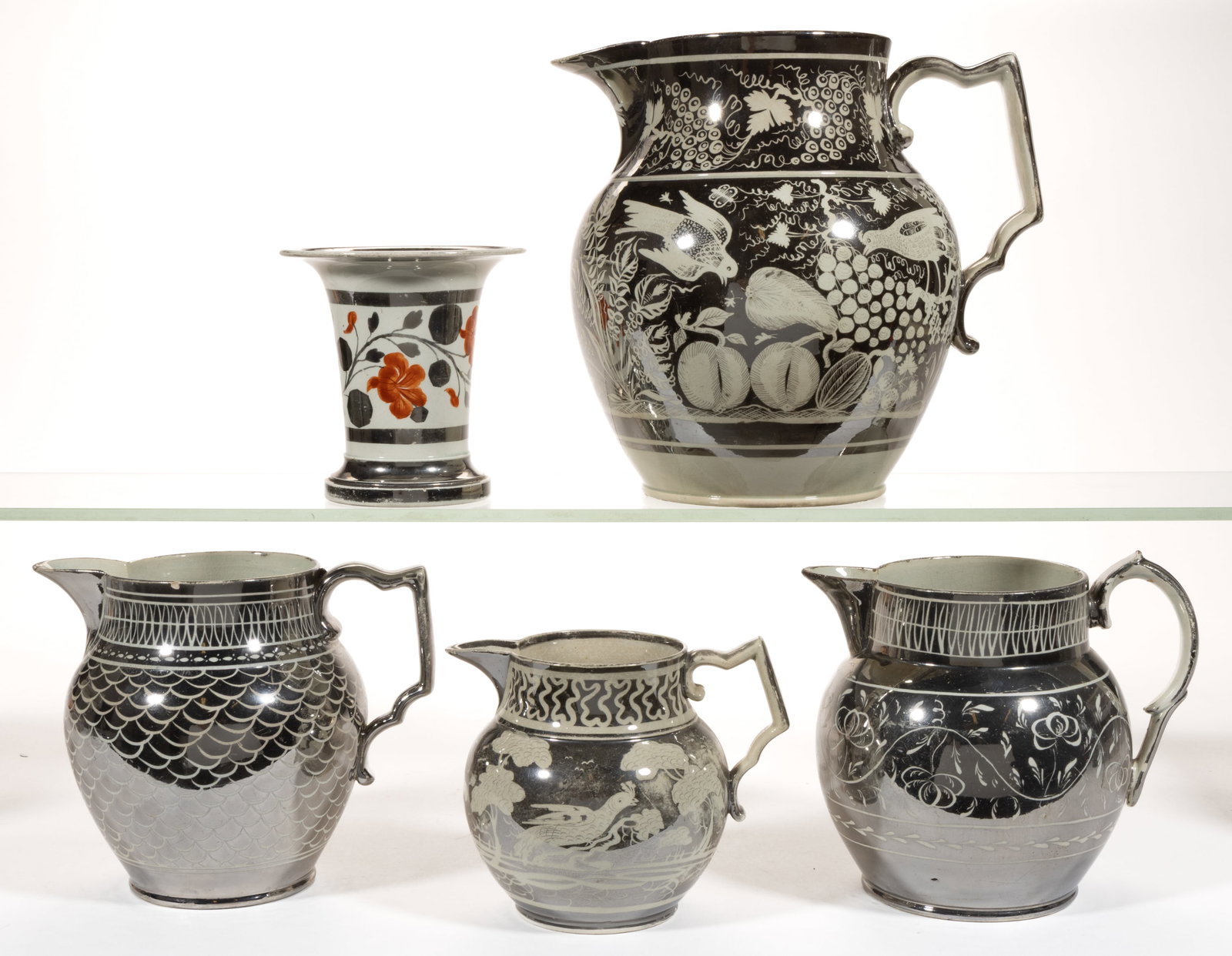 ENGLISH SILVER LUSTRE CERAMIC ARTICLES, LOT OF FIVE: ENGLISH SILVER LUSTRE CERAMIC ARTICLES, LOT OF FIVE, comprising one fluted vase with red hand-painted floral design and four jugs/pitchers having resist decorations consisting of one with fi