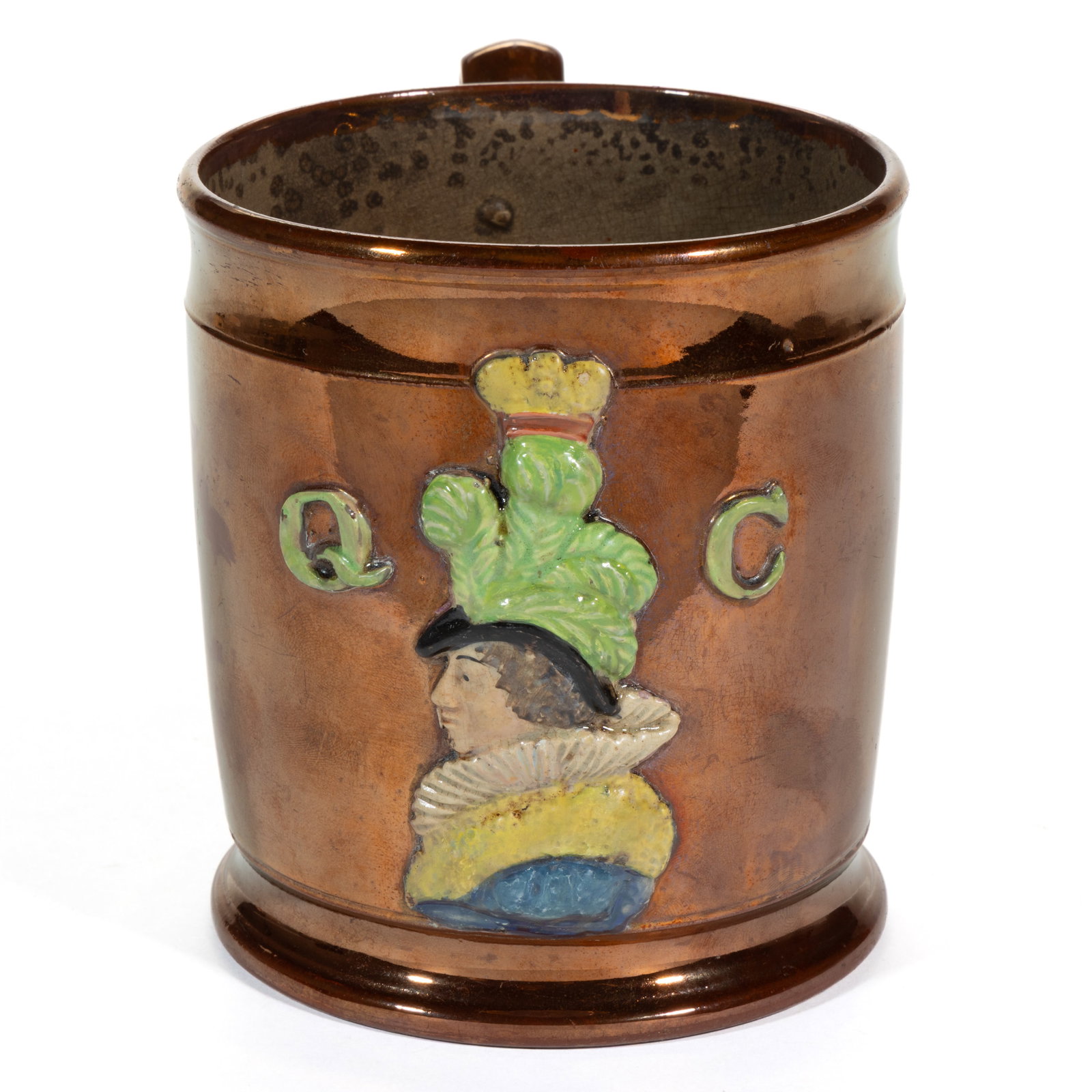 BRITISH COPPER LUSTRE QUEEN CAROLINE CERAMIC MUG: BRITISH COPPER LUSTRE QUEEN CAROLINE CERAMIC MUG, featuring embossed polychrome hand-painted profile of the Queen wearing a feathered hat with a small crown to top and flanked by "Q" an