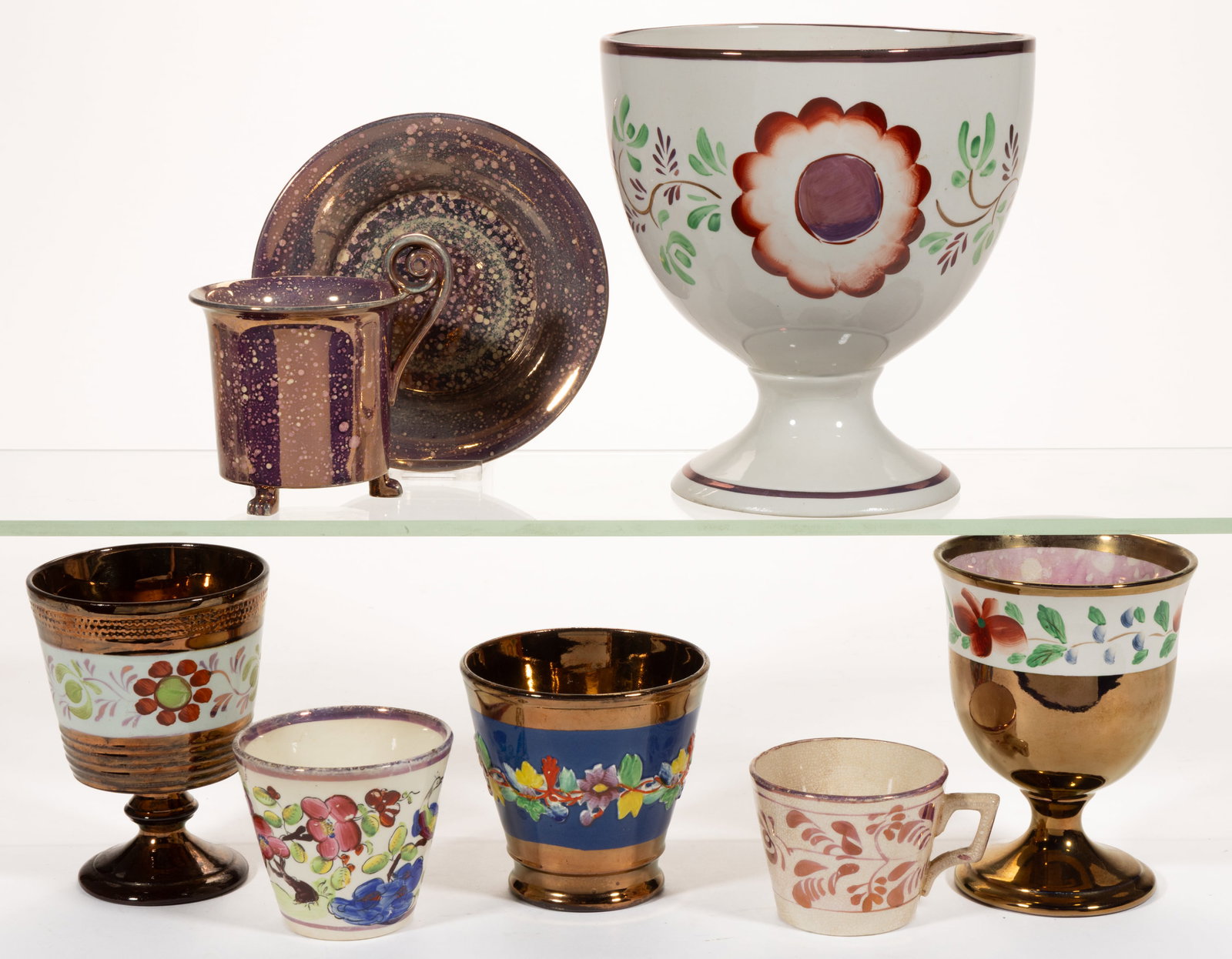 BRITISH AND FRENCH LUSTRE-DECORATED DRINKING AND OTHER ARTICLES, LOT OF SEVEN: BRITISH AND FRENCH LUSTRE-DECORATED DRINKING AND OTHER ARTICLES, LOT OF SEVEN, comprising three copper lustre examples having polychrome floral designs including a beaker with relief design on a blue 