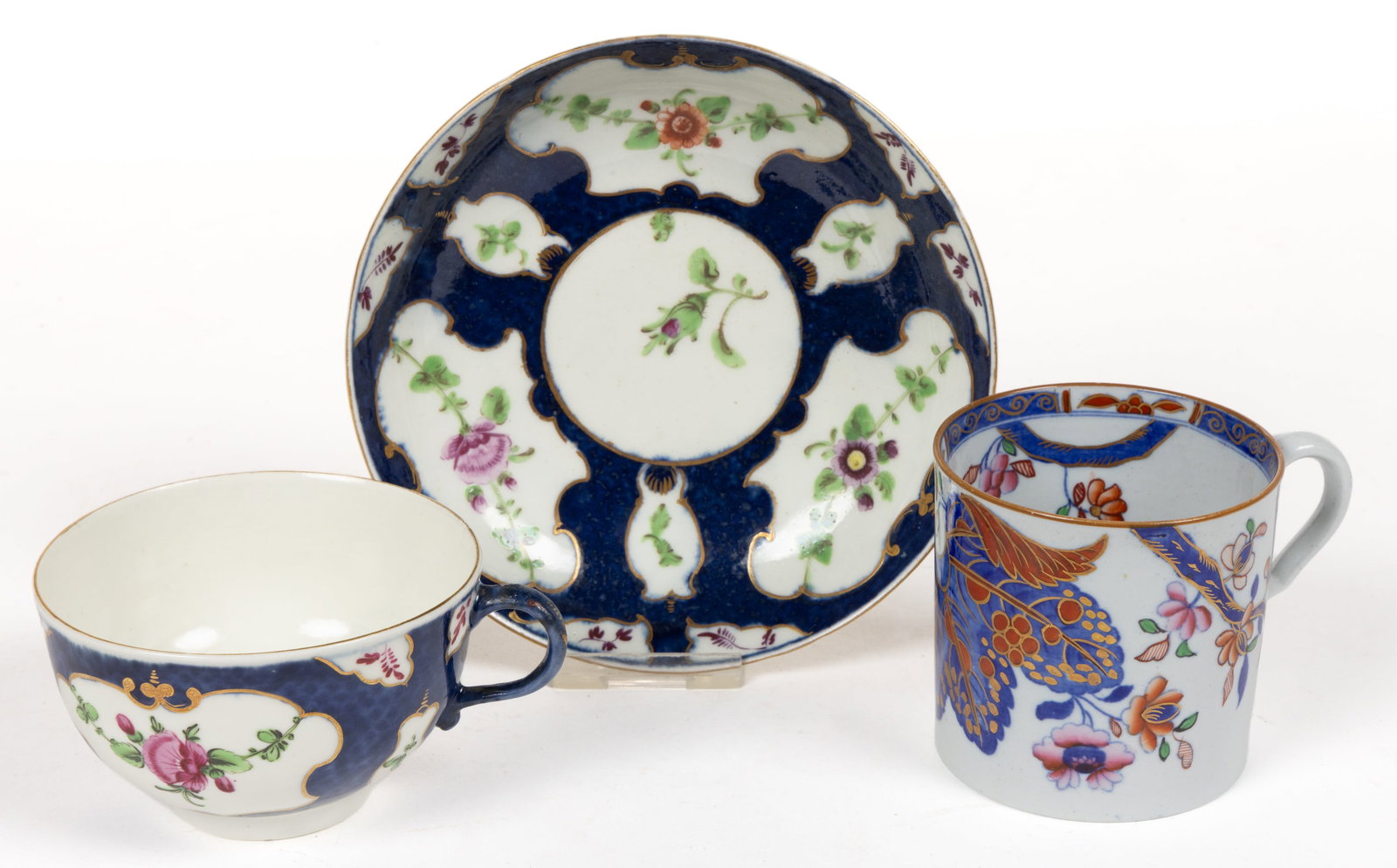 ENGLISH DR. WALL WORCESTER SCALE BLUE PORCELAIN CUP AND SAUCER SET: ENGLISH DR. WALL WORCESTER SCALE BLUE PORCELAIN CUP AND SAUCER SET, featuring polychrome hand-painted flowers in panels and gilt accents. Blue marks include cup with crescent and saucer having square.