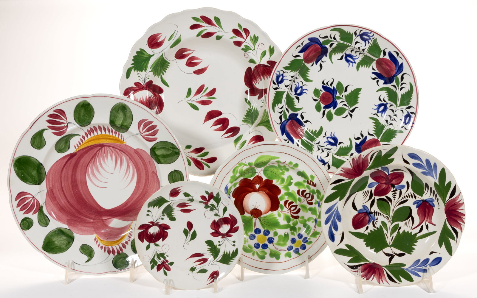 BRITISH HAND-PAINTED FLORAL MOTIF CERAMIC PLATES, LOT OF SIX: BRITISH HAND-PAINTED FLORAL MOTIF CERAMIC PLATES, LOT OF SIX, each having bold polychrome decorations, including a Cabbage Rose example, a Wood's Rose example, and two having Adams Rose decoration