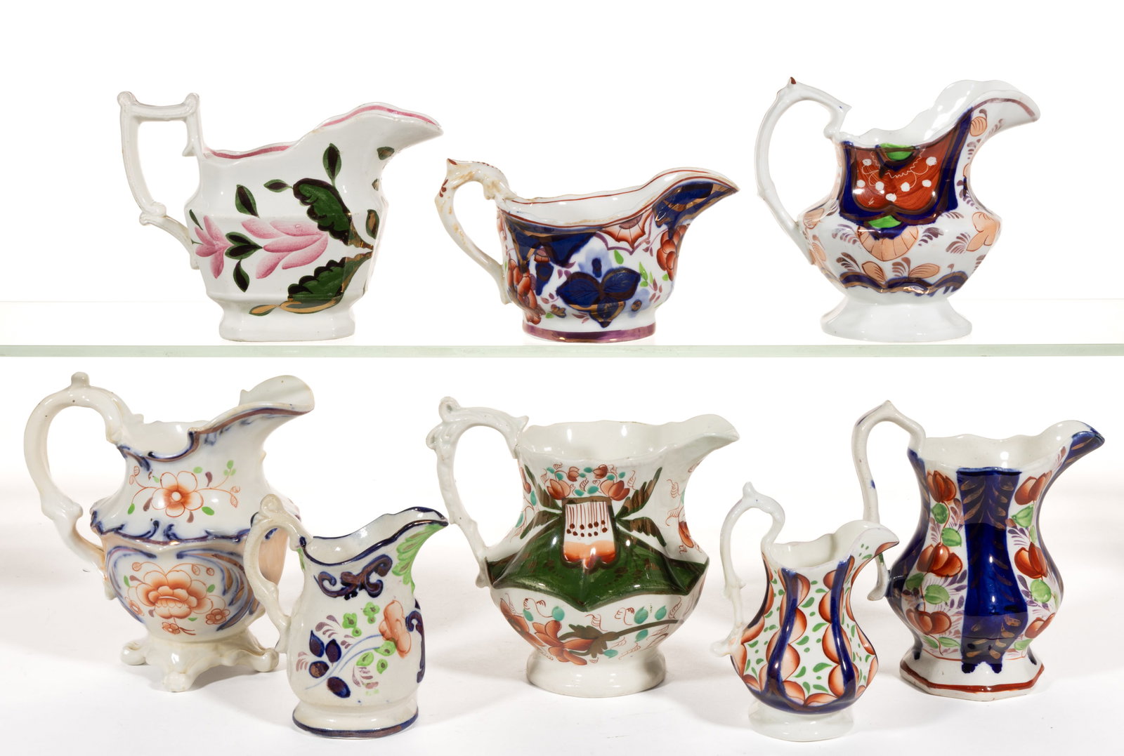 BRITISH GAUDY WELSH FLORAL MOTIF CERAMIC JUGS / CREAMERS, LOT OF EIGHT: BRITISH GAUDY WELSH FLORAL MOTIF CERAMIC JUGS / CREAMERS, LOT OF EIGHT, including one miniature jug having Glamorgan pattern, one example featuring Ross pattern, one 4" H example with Basket