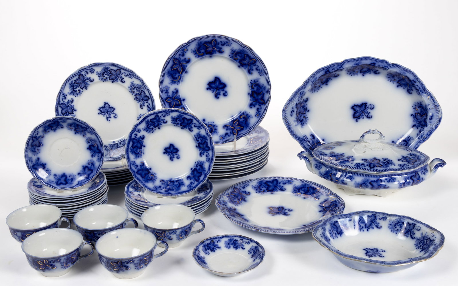 ENGLISH FLOW BLUE "PRINCETON" CERAMIC TEA AND TABLE ARTICLES, LOT OF 48: ENGLISH FLOW BLUE "PRINCETON" CERAMIC TEA AND TABLE ARTICLES, LOT OF 48, each having ivy leaf with diminutive flower designs and gilt accents, including a 14 1/2" x 10 3/4" pl