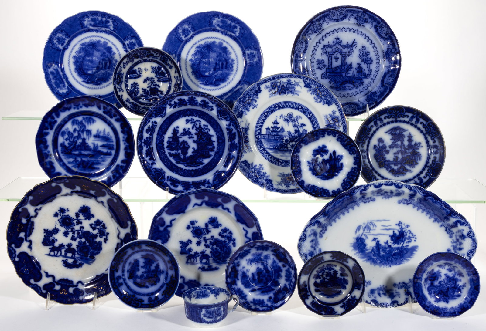 EUROPEAN FLOW BLUE CERAMIC CHINOISERIE MOTIF TEA AND TABLE ARTICLES, LOT OF 17: EUROPEAN FLOW BLUE CERAMIC CHINOISERIE MOTIF TEA AND TABLE ARTICLES, LOT OF 17, including a 14 1/4" x 10 1/4" platter having Geisha pattern, two small dishes including one with Indian J