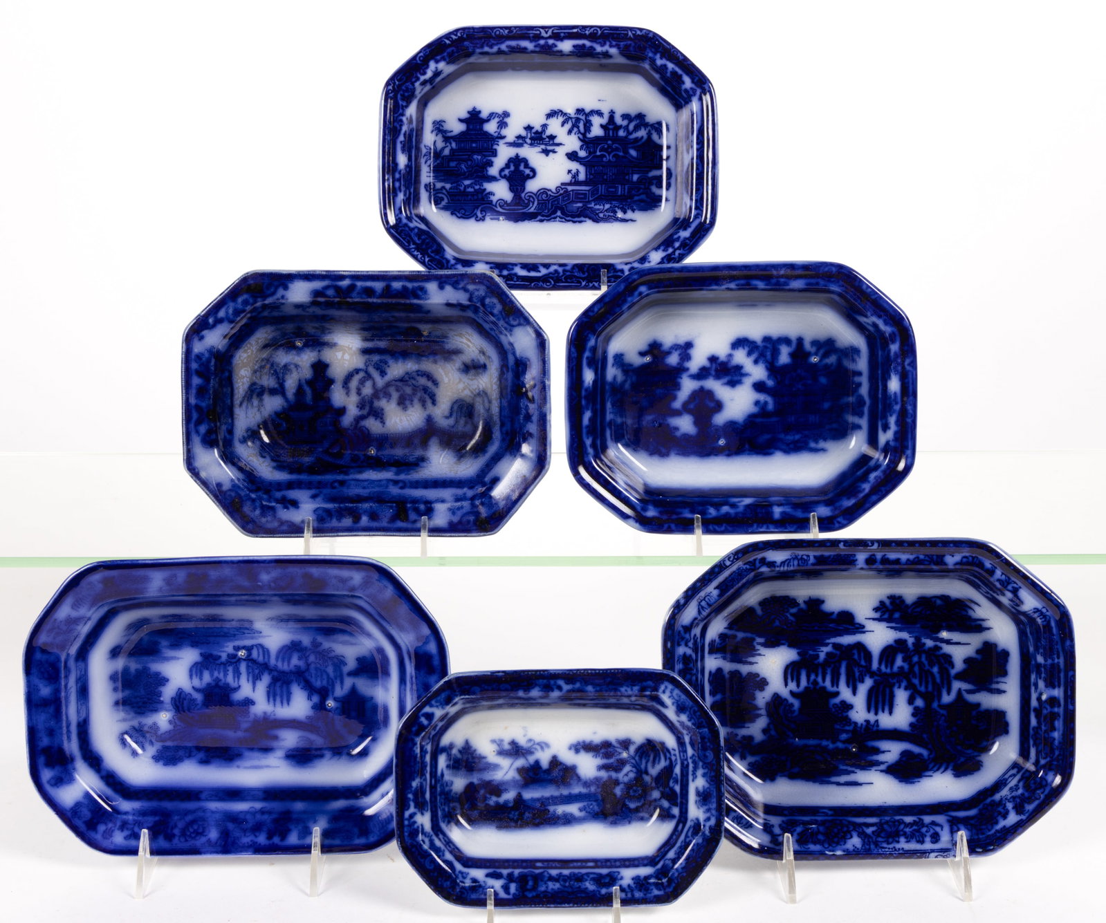 ENGLISH STAFFORDSHIRE FLOW BLUE CHINOISERIE MOTIF IRONSTONE OPEN VEGETABLE DISHES, LOT OF SIX: ENGLISH STAFFORDSHIRE FLOW BLUE CHINOISERIE MOTIF IRONSTONE OPEN VEGETABLE DISHES, LOT OF SIX, each of elongated octagonal form, comprising two with "MANILLA", two having Temple, and remaini