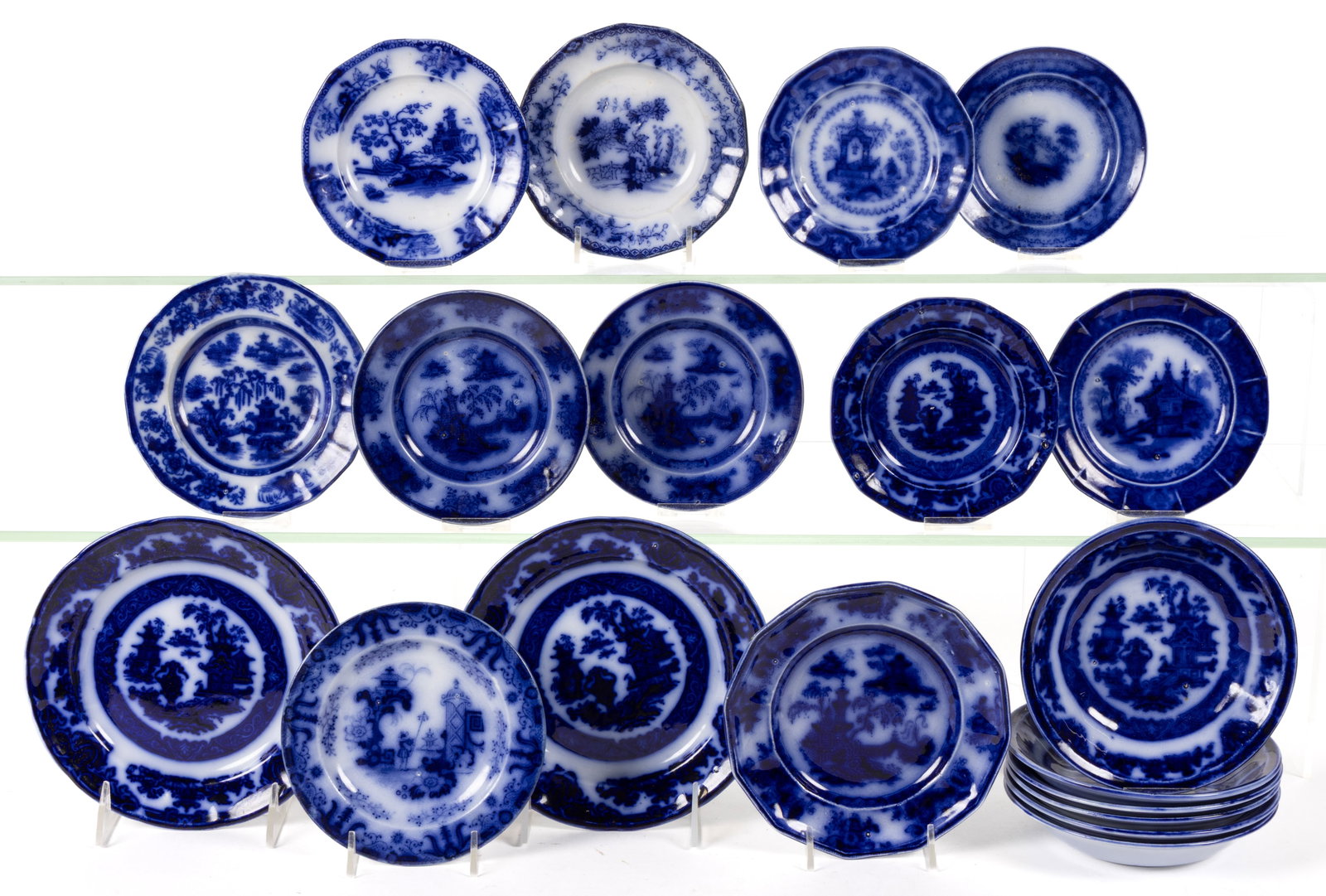 ENGLISH STAFFORDSHIRE FLOW BLUE IRONSTONE DIMINUTIVE PLATES AND OTHER ARTICLES, LOT OF 19: ENGLISH STAFFORDSHIRE FLOW BLUE IRONSTONE DIMINUTIVE PLATES AND OTHER ARTICLES, LOT OF 19, comprising three examples having "PELEW" pattern, nine examples having "TEMPLE" pattern c