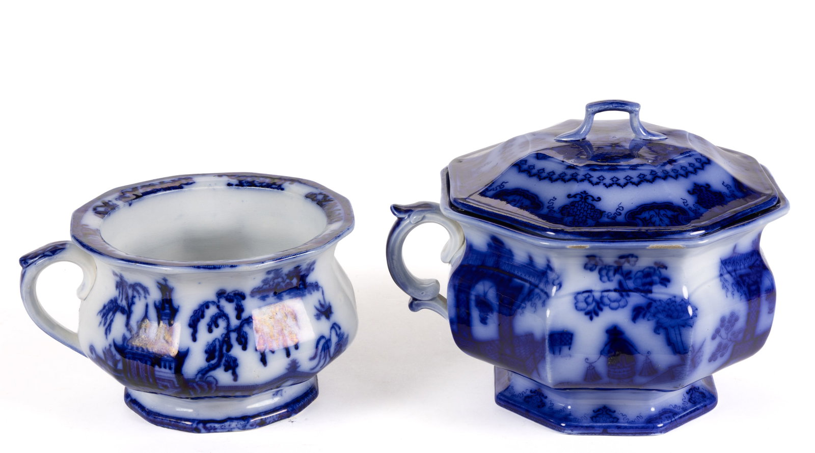 ENGLISH STAFFORDSHIRE FLOW BLUE CHINOISERIE MOTIF IRONSTONE CHAMBER POTS, LOT OF TWO: ENGLISH STAFFORDSHIRE FLOW BLUE CHINOISERIE MOTIF IRONSTONE CHAMBER POTS, LOT OF TWO, comprising one 8" D 12-sided example featuring "PELEW" pattern and one 9 3/8" D octagonal